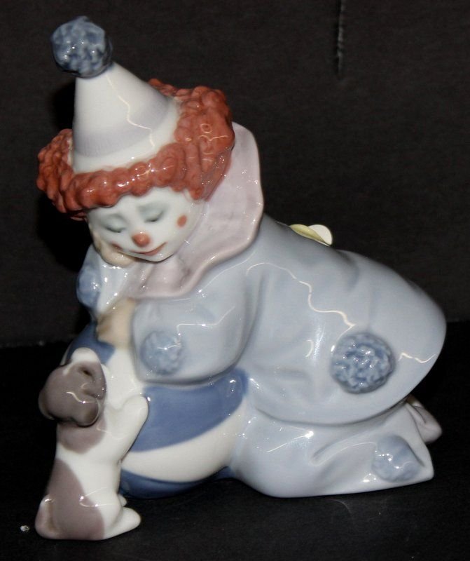 Lladro Pierrot w/ Puppy & Ball' #5278 Porcelain Group: Lladro Pierrot w/ Puppy & Ball' #5278 Porcelain Group. Sculptor - Jose Puche, issued - 1985, retired - 2007. Measures - 4 3/4" high.