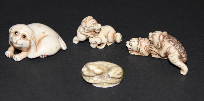 Collection of 4 Japanese Carved Ivory Netsuke's: Collection of 4 Japanese Carved Ivory Netsuke's. Weighs - 55.6 grams. Measures - 1 1/2" long approx. Please Contact - Tom at the UPS Store (561-739-9180) (tupss2807@gmail.com) for shipment of ivory. A