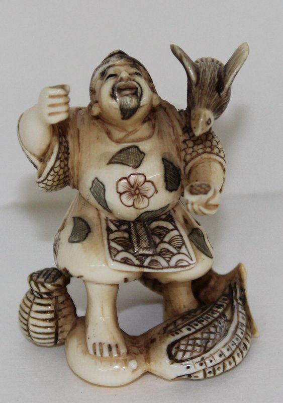 Japanese Polychrome Carved Ivory Netsuke: Japanese Polychrome Carved Ivory Netsuke, depicting man with bird. Measures - 2" high. Weighs - 24.7 g.