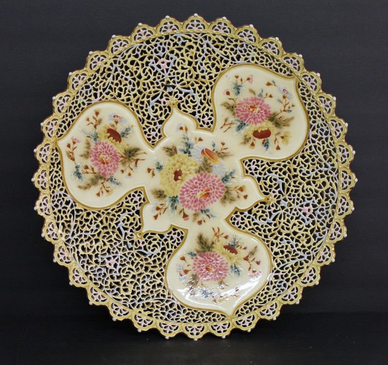Zsolnay Hand Painted & Pierced Porcelain Charger: Zsolnay Hand Painted & Pierced Porcelain Charger. Depicting flowers. Signed on bottom. Measures - 18 1/2" diameter.