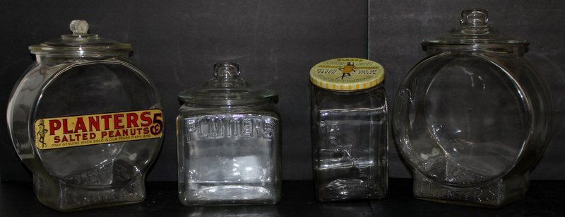 4 Pc. Planters Peanut Jars: 4 Pc. Planters Peanut Jars. Measures - 10" high - 13 1/2" high.