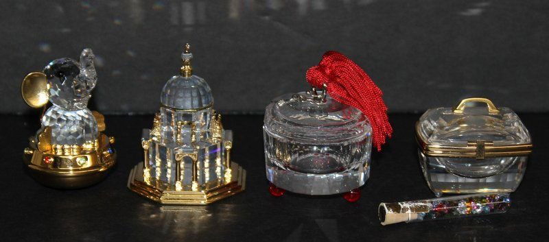 Lot of 4 Swarovski Crystal Misc. Pieces: Lot of 4 Swarovski Crystal Misc. Pieces, toy elephant - 2" high (retail - $90), cathedral - 2" high (retail - $110) jewelry box - 2" high (retail - $90) beauty box - 1 1/4" high (retail - $85).