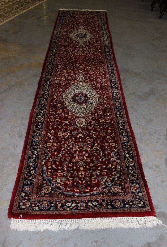 Hand Made Indian Runner Rug: Hand Made Indian Runner Rug. Stylized wool runner featuring two pendants. Measures - 148" long x 33 1/2" wide.