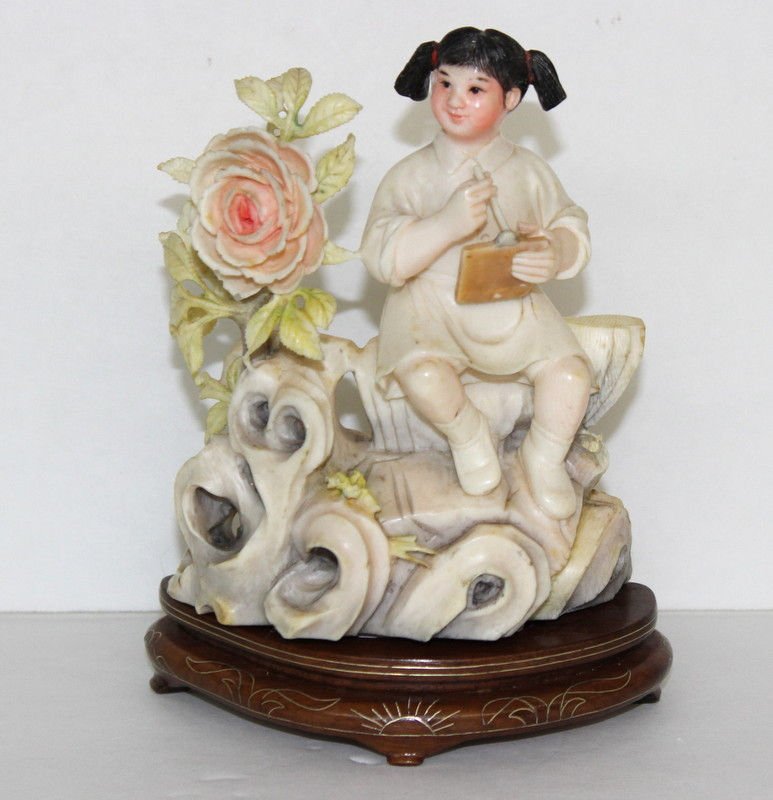Japanese Finely Carved Ivory Young Girl: Japanese Finely Carved Ivory Young Girl. Ivory measures - 4 1/2" high, total measures - 5 1/2" high. Weighs - 291.7 grams. INTERNATIONAL CLIENTS ARE INELIGIBLE TO BID ON THIS ITEM. THIS ITEM IS FOR SA