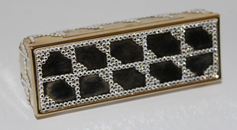 Judith Leiber Swarovski Crystal Lip Stick Case: Judith Leiber Swarovski Crystal Lip Stick Case. Weight - 75.5 grams. Measures - 3 1/2" long x 1 1/4" high.