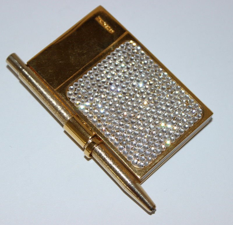 Judith Leiber Swarovski Crystal Note Pad: Judith Leiber Swarovski Crystal Note Pad. Weight - 43.3 grams. Measures - 2 3/4" long.