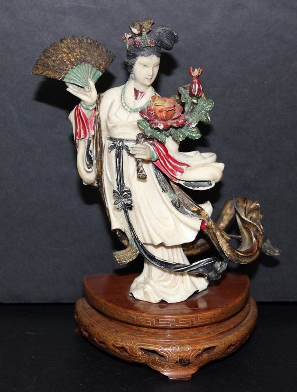 19-20th C. Chinese Carved Polychrome Ivory Figure: 19-20th C. Chinese Carved Polychrome Ivory Figure. Ivory measures - 5 1/4" high. Total height with base - 6 1/2" high. Weight - 190.6 grams. INTERNATIONAL CLIENTS ARE INELIGIBLE TO BID ON THIS ITEM. T