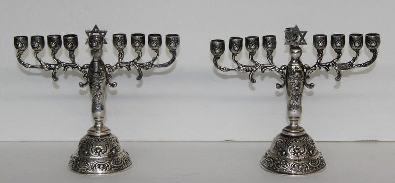 Pair of European Sterling Silver Menorahs: Pair of European Sterling Silver Menorahs. Hand chased. Marked 925. Measures - 6 1/2" high x 2 1/2" long base. Weight - 3.5 troy oz.