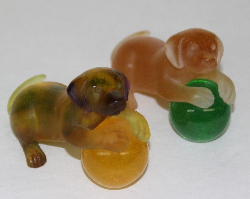 (2) Daum Signed Pate de Verre Dog Figurine: (2) Daum Signed Pate de Verre Dog Figurine. Also called "Chiot et Ballon". Made in France. Measures - 2 1/4" high x 3 1/2" long, both marked Daum France.