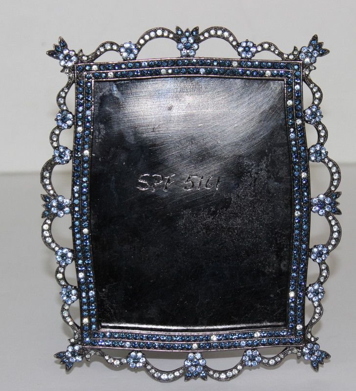 Jay Strongwater Blue & Clear Crystal Picture Frame: Jay Strongwater Blue & Clear Crystal Picture Frame. Measures - 6 1/4" x 5 1/4", glass size - 3 1/4" x 4 1/2". Condition - missing glass and one back hinge and on crystal.