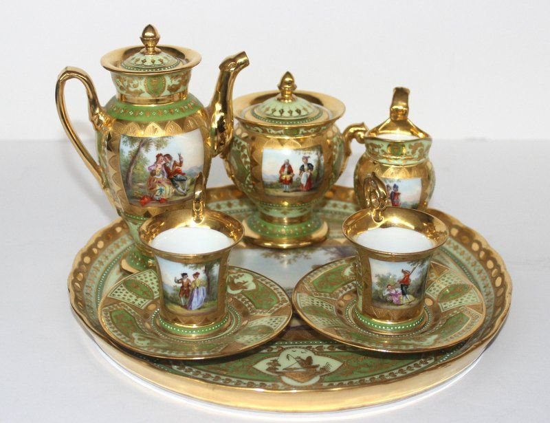 8 Pc. Royal Vienna Hand Painted Demi-Tasse Porcelain: 8 Pc. Royal Vienna Hand Painted Demi-Tasse Porcelain Tea Set. Gilt trimming throughout. Plate - 9 1/4" diameter, creamer - 3 1/2" high, cup and saucer - 2 3/4" high x 3 3/4" diameter, covered sugar -