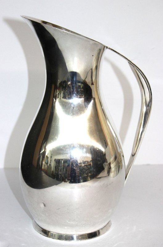 Tiffany & Co. Sterling Silver Pitcher: Tiffany & Co. Sterling Silver Pitcher. Approx. 28 troy oz. 3 1/4 pint size. Measures - 10" high x 7" wide. Age appropriate wear.