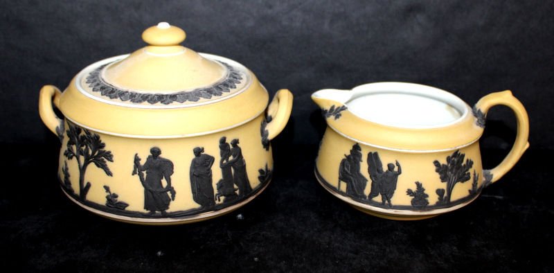 2 Pc. Wedgwood Black & Cream Jasperware Creamer & Sugar: 2 Pc. Wedgwood Black & Cream Jasperware Creamer & Sugar. Creamer - 2" high, sugar - 3 1/2" high.
