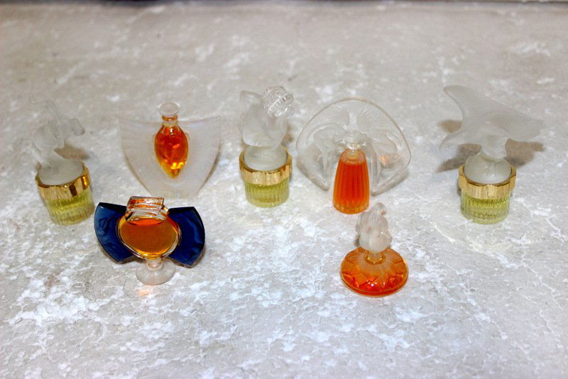 7 Miniature Lalique Perfume Bottles: 7 Miniature Lalique Perfume Bottles.