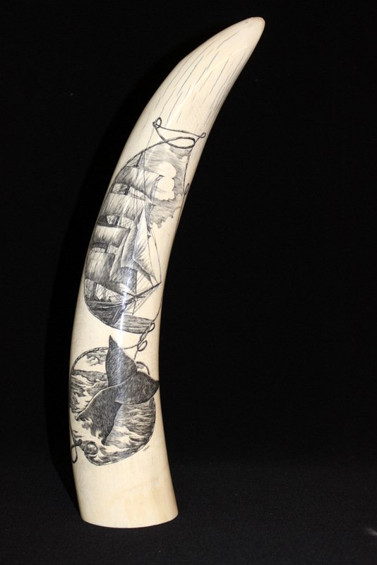American Scrimshaw Solid Ivory Tusk: American Scrimshaw Solid Ivory Tusk. Boats and whale at sea. Measures - 15 1/4" high. Signed Jones. Weight - 1,659.9 grams. THIS LOT IS THIRD QUARTER 20TH CENTURY, OR EARLIER ORIGIN. INTERNATIONAL CLI