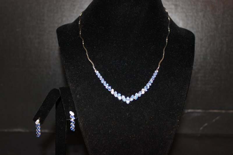 Contemporary 18Kt WG Sapphire Suite, 6.00cts: Contemporary 18Kt WG Sapphire Suite, 6.00cts. The suite features a necklace with matching earrings that are sectional semi-ridged wave design centrally set with a graduating double row of 58 round fac