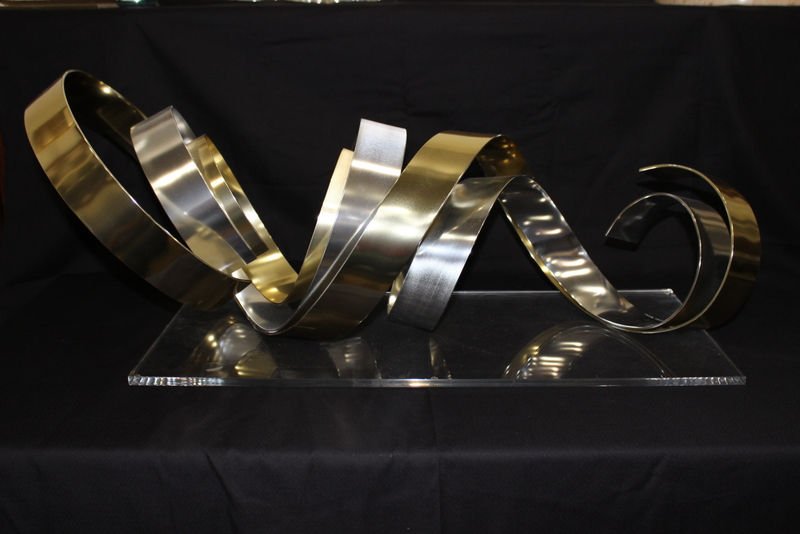 Dan Murphy 20th C. Abstract Metal Sculpture: Dan Murphy 20th C. Abstract Metal Sculpture. On lucite base, signed Dan Murphy. Measures - 34" long x 15" wide.