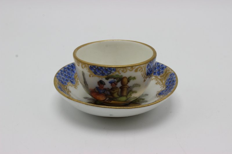 Meissen Miniature Hand Painted Porcelain Tea Cup &: Meissen Miniature Hand Painted Porcelain Tea Cup & Saucer. Measures - 1 1/4" high.