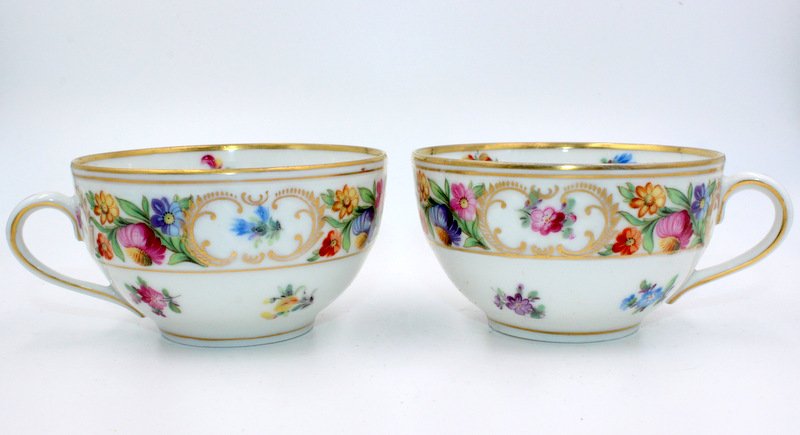 12 Dresden Porcelain Tea Cups: 12 Dresden Porcelain Tea Cups with Gilded & floral decorated borders. Measures - 2" high x 3 1/2" wide.