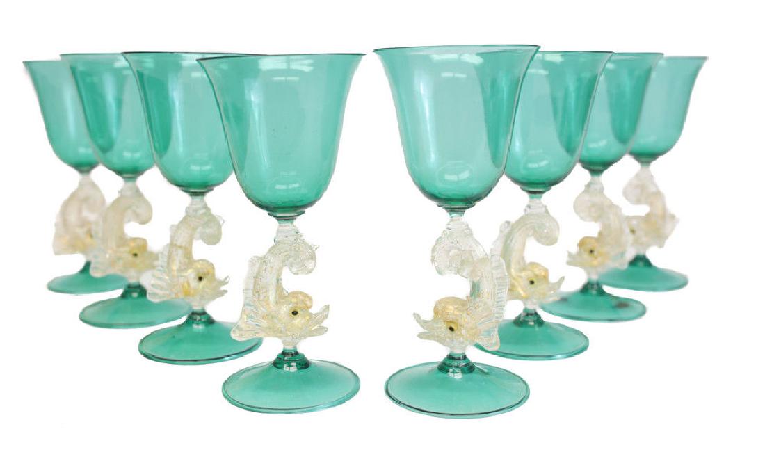 Venetian Green Wine Art Glasses: 8 Venetian green art glass wine glasses with gold flecks wine glasses, with figural gold dolphin stems. circa 1950. Attributed to Salivati. Measures: 2.9 inch diameter x 6.25 inches Domestic Shipping: