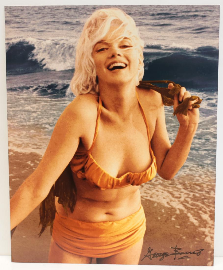 Marilyn Monroe Photograph George Barris: A limited edition George Barris photograph of Marilyn Monroe, depicting Marilyn Monroe on the beach wearing orange bikini. Signed by George Barris in marker (lower right). Stamped and numbered 23/40 o