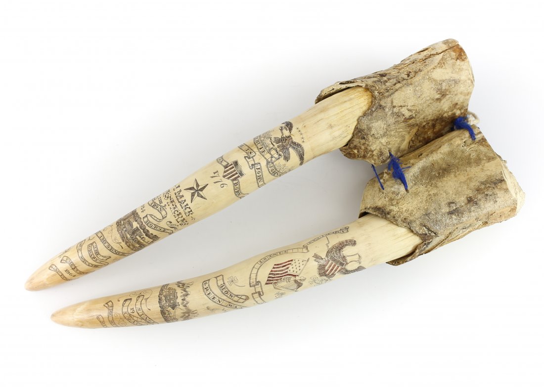 Pair Skrimshaw Walrus Tusks Engraved Tribute to John: Pair of large walnut tusks of eskimo origin. Engraved with various patriot symbols including a reference to United States nationhood in 1776, centered around a tribute to John Ford, commemorating hit