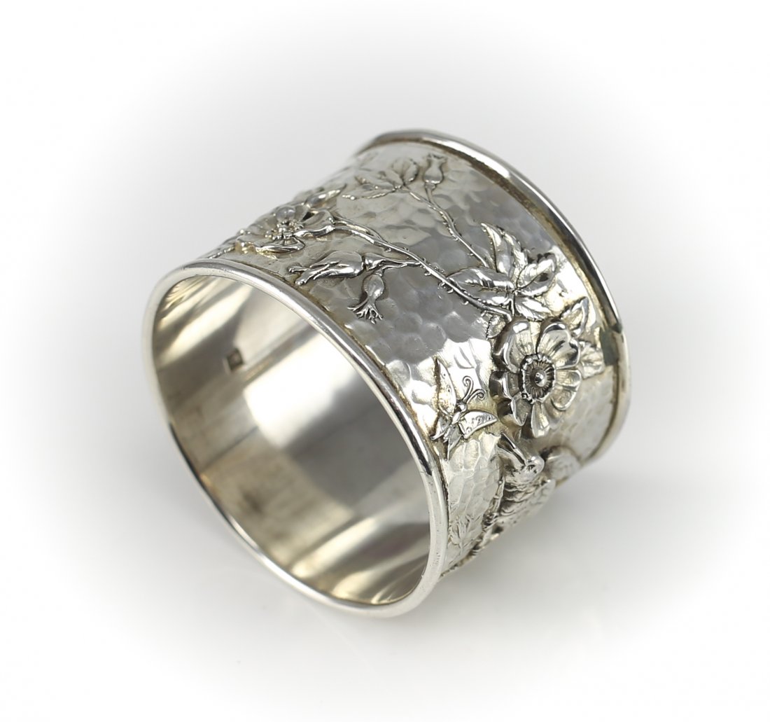 1866 John Round Sons Sheffield Sterling Silver Napkin: 1866 Sheffield sterling silver bapkin ring by John Round & Sons Ltd. Incredible hand hammered with thick raised bird & floral design. Measures: 1 3/8 x 1 7/8", weighs 47.6g Shipping Estimate: $8