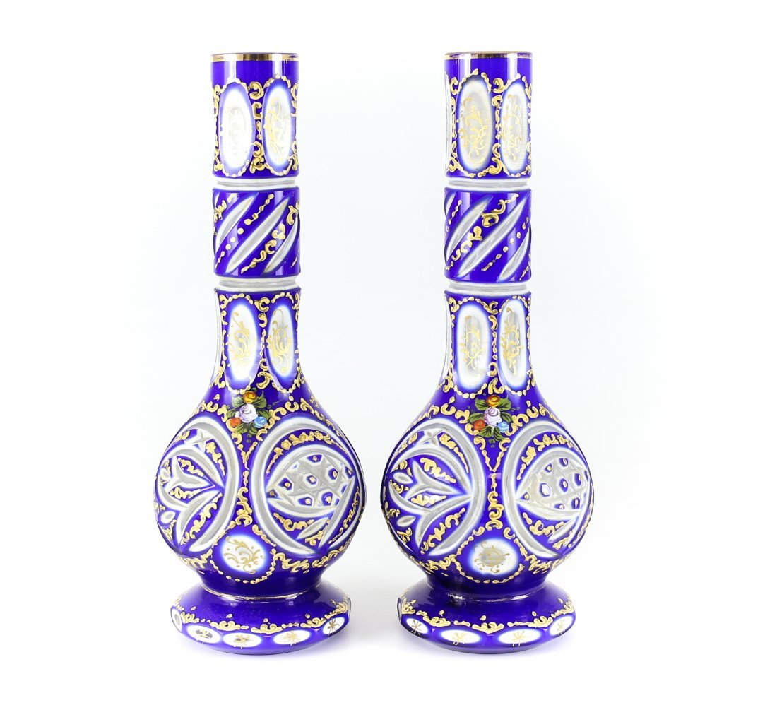 c.1920 Pair of Czech Three Layer Overlay Art Glass: Striking pair of Czech or Bohemian vases dating to first quarter of 20th Century. Features three layers of colored and cut glass, Cobalt blue, over white, over clear. Hand painted enamel scrolls and g