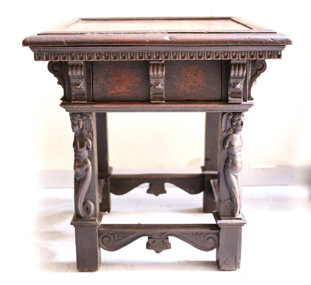 17th Century Gothic Chess Marquetry Table: An equisite 17th Century Gothic Chess table with pull out drawer. Featuring handmade marquetry inlaid into a chess board. Legs are beautifully hand carved all with mermaid figures. Measures: 29 inch x