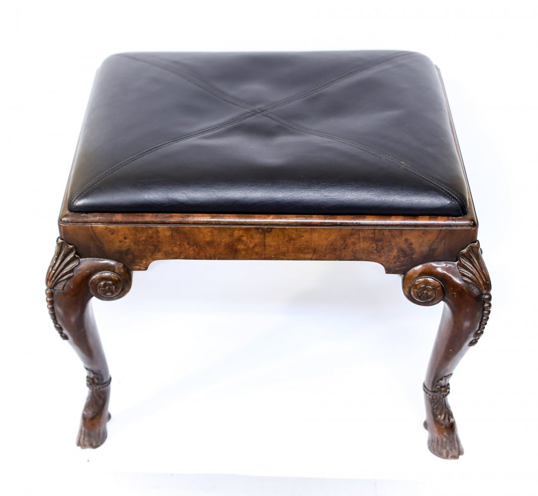 A 19th century English wooden bench or leg rest: "A 19th century English hand carved wood bench or leg rest. Horse hoof formed wooden feet, modern leather upholstery. Measures:24 inch length x 18.5 inch width x 20 inch height Domestic Shipping: Plea