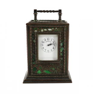 Tiffany Studios Bronze Carriage Clock Grapevine: A Tiffany Studios bronze desk carriage clock in Grapevine pattern. 19th Century, Numbered 37, with French movement. Includes winding key. Measures: 5 inches tall Domestic Shipping: $45