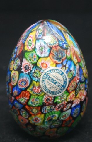 VINTAGE MILIFIORI MURANO VENETIAN GLASS PAPERWEIGHT: GENUINE VINTAGE MILIFIORI MURANO VENETIAN GLASS PAPERWEIGHT MADE IN THE SHAPE OF AN EGG. HAS THE VENETIAN GLASS PAPER LABEL. GOOD CONDITITON: SLIGHT OVERLAP OF GLASS IN THE CENTER IN THE MAKING OF. Me