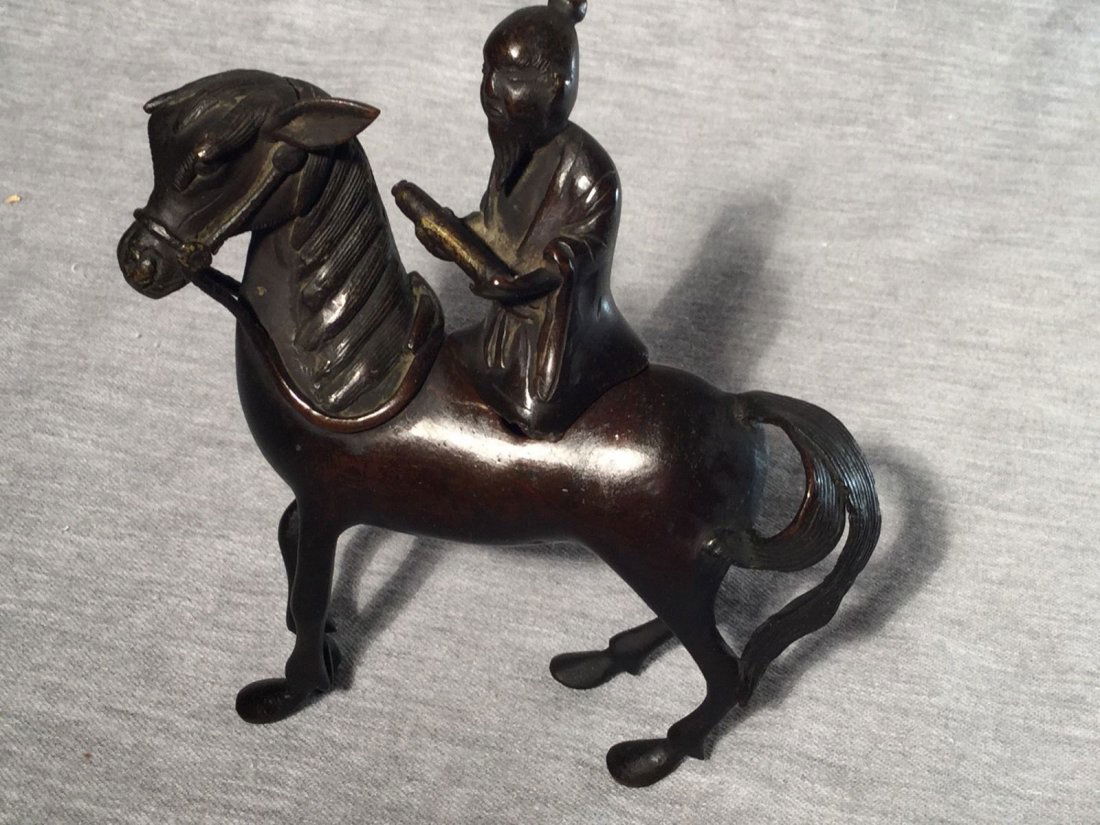 A Chinese Bronze Incense Burner Scholar Riding Horse: This is an incense burner in the shape of a scholar riding a horse or donkey. Height is 6 inches