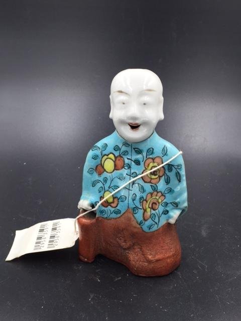 A Chinese multicolor porcelain figure kowtow (1 of 5)