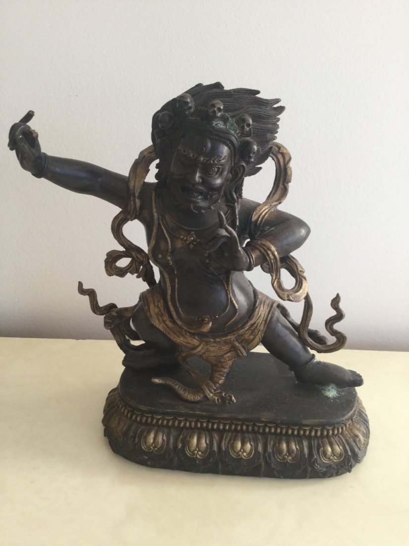 A Chinese Bronze Statue of A Buddhist Guardian: A Chinese Bronze Statue of A Buddhist Guardian from Tibetan Buddhism. Dimension is 12.5 x 10 x 5 inches.