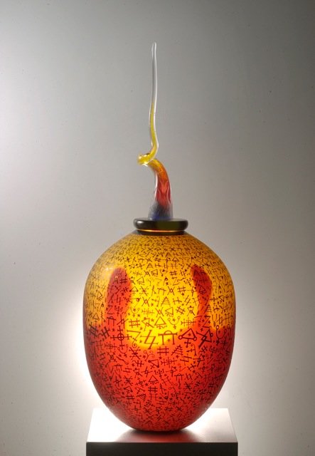 Duncan McClellan: Alchemist Fire - Hand blown glass, sand carved overlay 41h x 16w x 16d Signed, 2011 Duncan McClellan is a Rising Star, whose work depicts emotions relating to the spiritual connections between each of