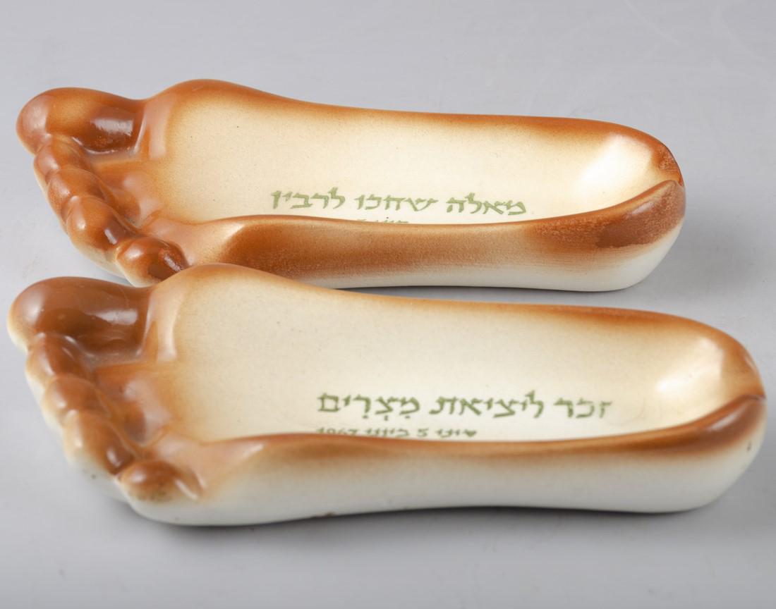 Lot of 2 Ceramic Ashtrays - 6 Day War: Lot of 2 Ceramic Ashtrays, made by "Avnit", decorated as foots in memorial of 6 day, Hebrew inscriptions. Height 3 cm. Minor flaws on the bottom.