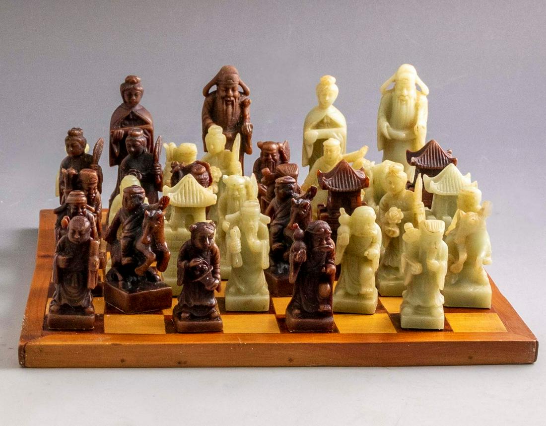 Chinese Chess Set: Chinese chess set, including: wooden board and 32 carved soapstone pieces (complete). Dimensions of board: 27.5X27.5 cm. Height of pieces: 6-10 cm.