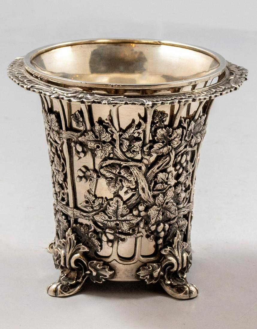 Ottoman Silver Goblet: Ca. 1900 Silver Ottoman goblet. Decorated with reliefs and openwork of floral motifs. Stands on 4 legs. Removable inner cup. Height: 9.5 cm, weight: 341 grams. Hallmarked