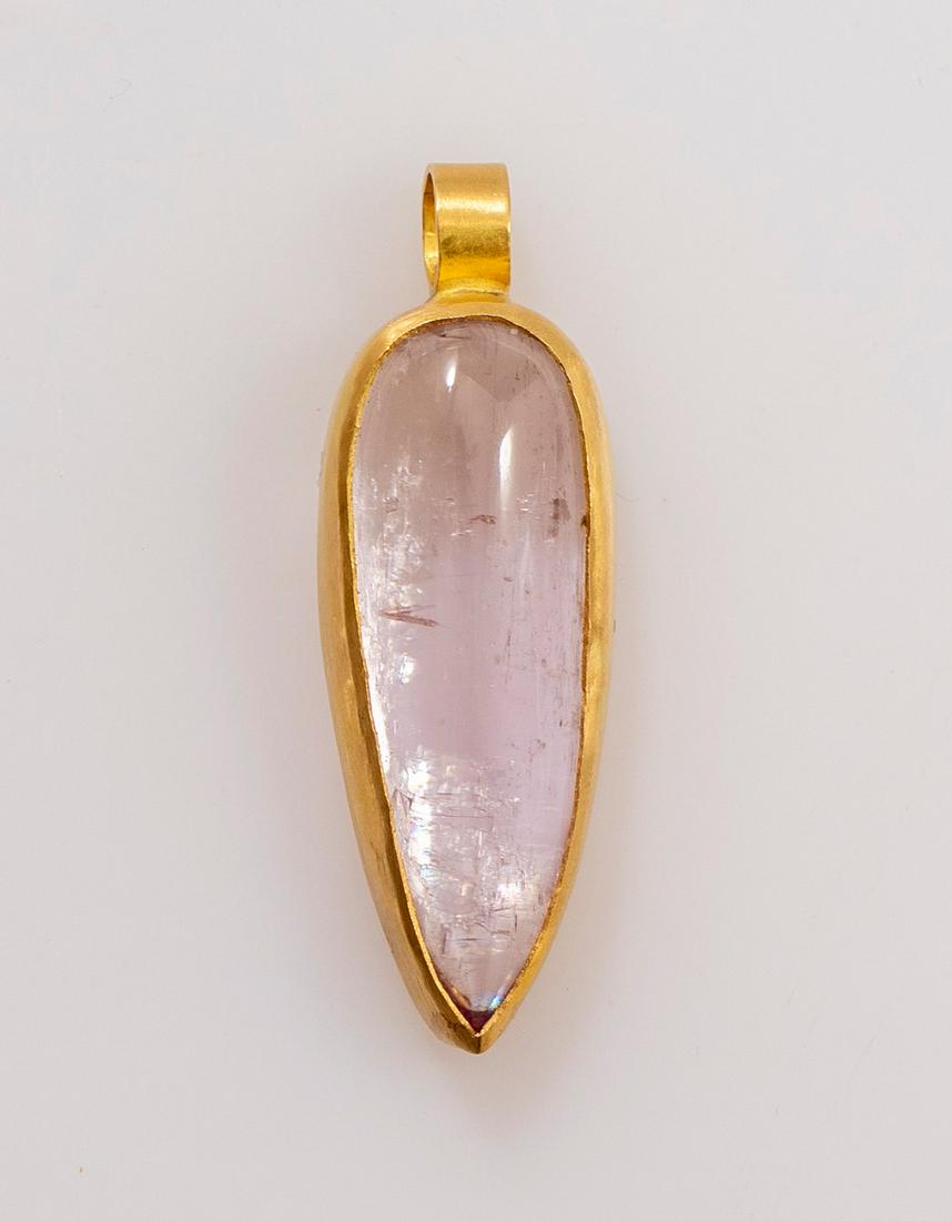 Gold Pendant: 22K gold Pendant, set with a pink stone. Length: 3 cm, weight: 6.4 grams.