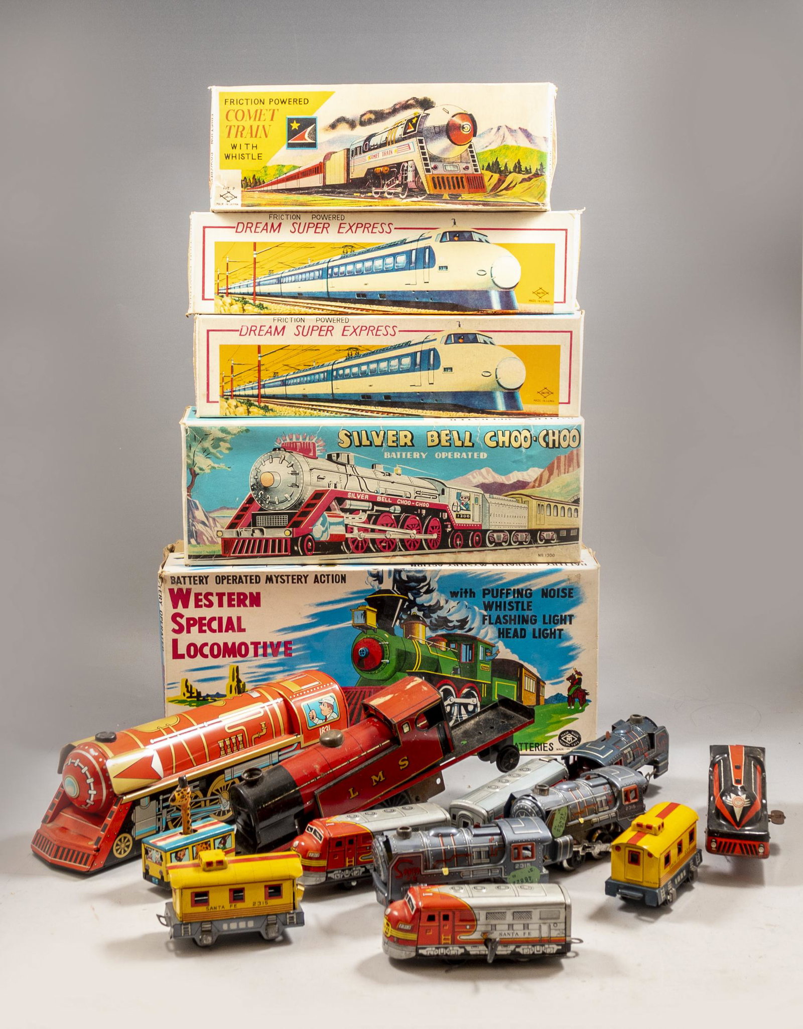 Vintage Toys and Trains: Lot of 17 vintage tin toys and cars including: Mercury train ,Western Special Locomotive, Comet train ,Express Freight Train Set, Dream Super Express and more. Various makers. Some work on batteries a