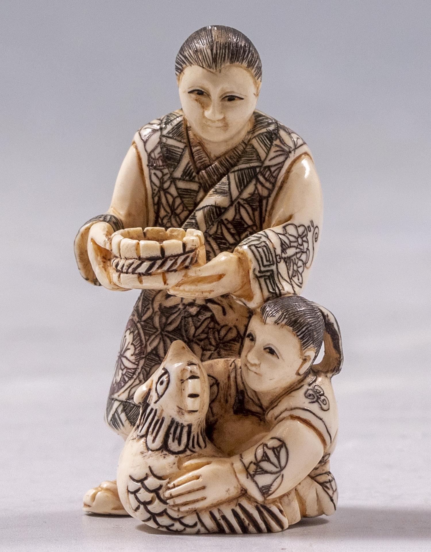 Japanese Carved Netsuke: Japanese Netsuke. Carved in the shape of women and a rooster. Height: 5 cm. Signed.