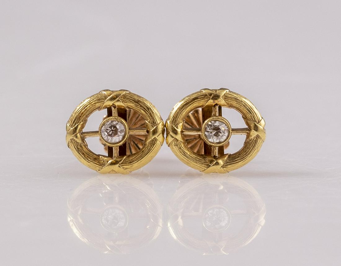 Gold & Diamon Earrings: Pair of 18K gold earrings (the clasp is 10K gold), each earring is set with a central diamond. Length: 13mm. Total weight: 3.8 grams (clasps: 0.4 grams). Unmarked, tested gold.