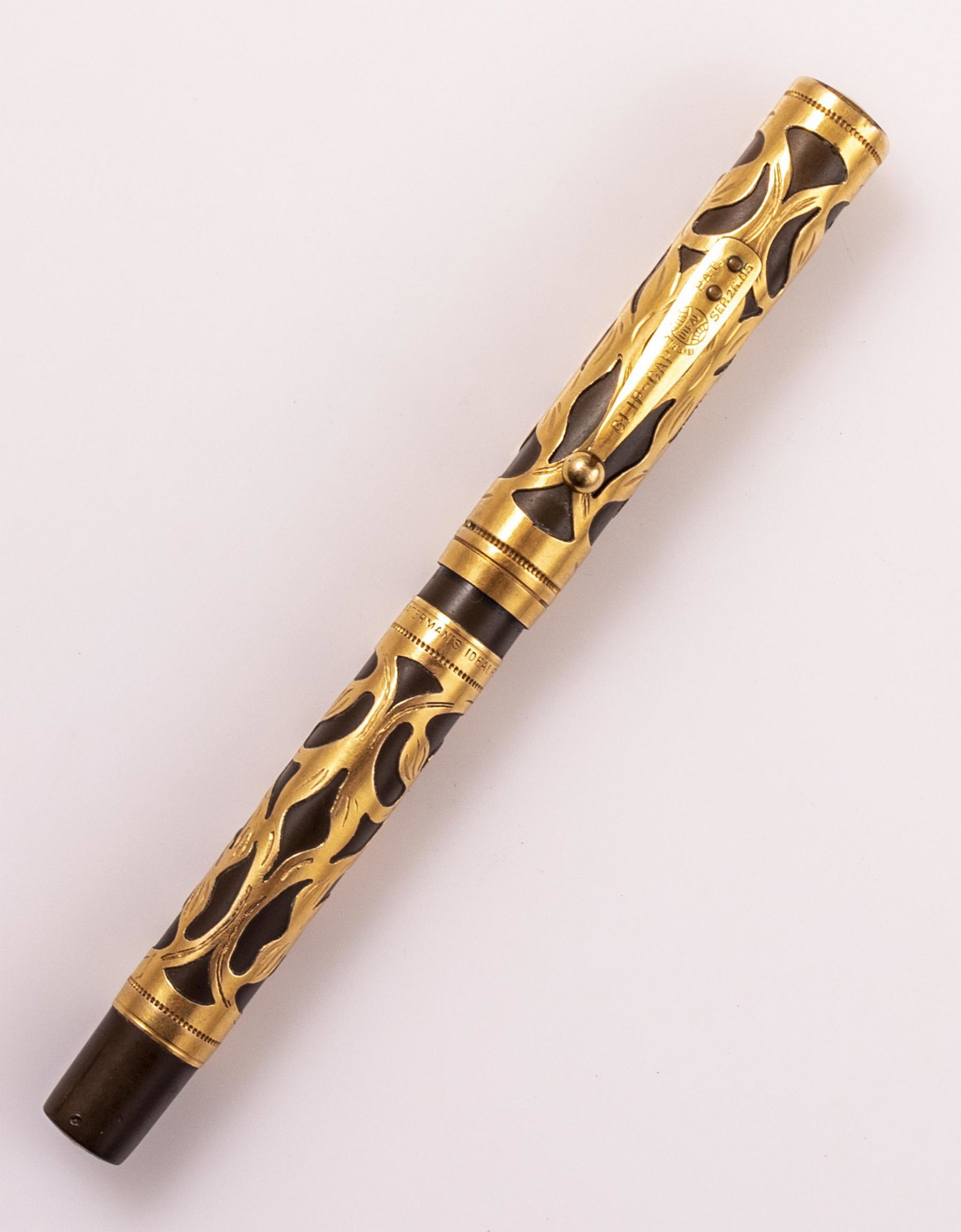 Waterman 0516 Fountain Pen: Waterman fountain pen, Model 516, Brown body with gold plated Filigree decorations. Size: 5.6" (14.2 cm). 14K gold nib, M. VG external condition, nib in good-very good condition, unknown working condi