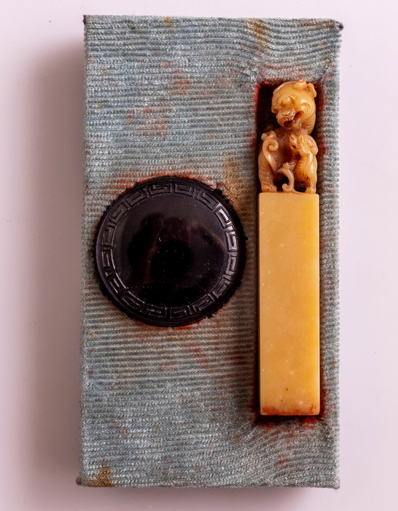 Chinese Carved Soapstone Seal: Chinese carved Soapstone seal, decorated with Foo dogs (Shi-Shi Lions). Length: 8 cm. Minor chip.