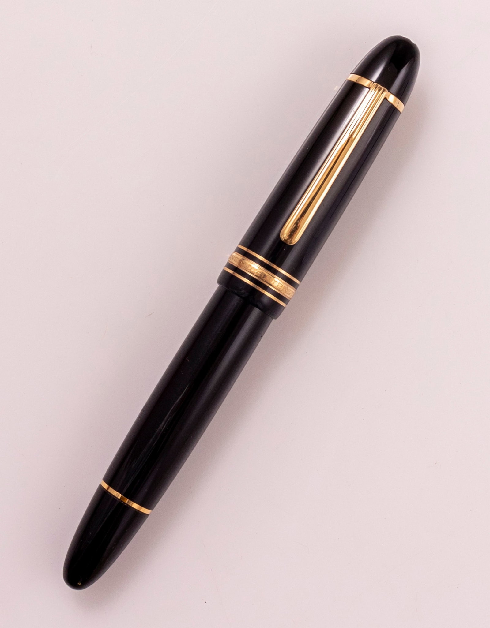 Montblanc Meisterstuck 149 Fountain Pen: Montblanc Meisterstuck 149 fountain pen, Black with GP trims. Size: 5.75" (14.8 cm). 2 toned 14K gold nib, M. Very good condition.