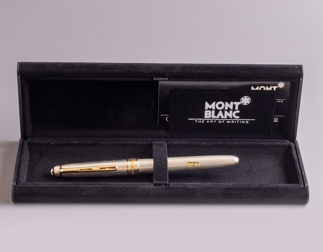 Montblanc Meisterstuck 144 Fountain Pen: Montblanc Meisterstuck fountain pen, West Germany, Sterling silver with Guilloche work & GP trims. Size: 5.3" (13.5 cm). 2 toned 18K gold nib, F. Mint, NOS, in original case.