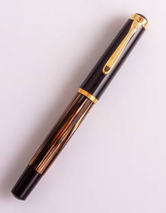 Pelikan M400 Fountain Pen: Pelikan M 400 fountain pen, Tortoise shell stripes and brown with GP trims. Size: 4.9" (12.5 cm). 14K gold nib, EF. Very good condition.