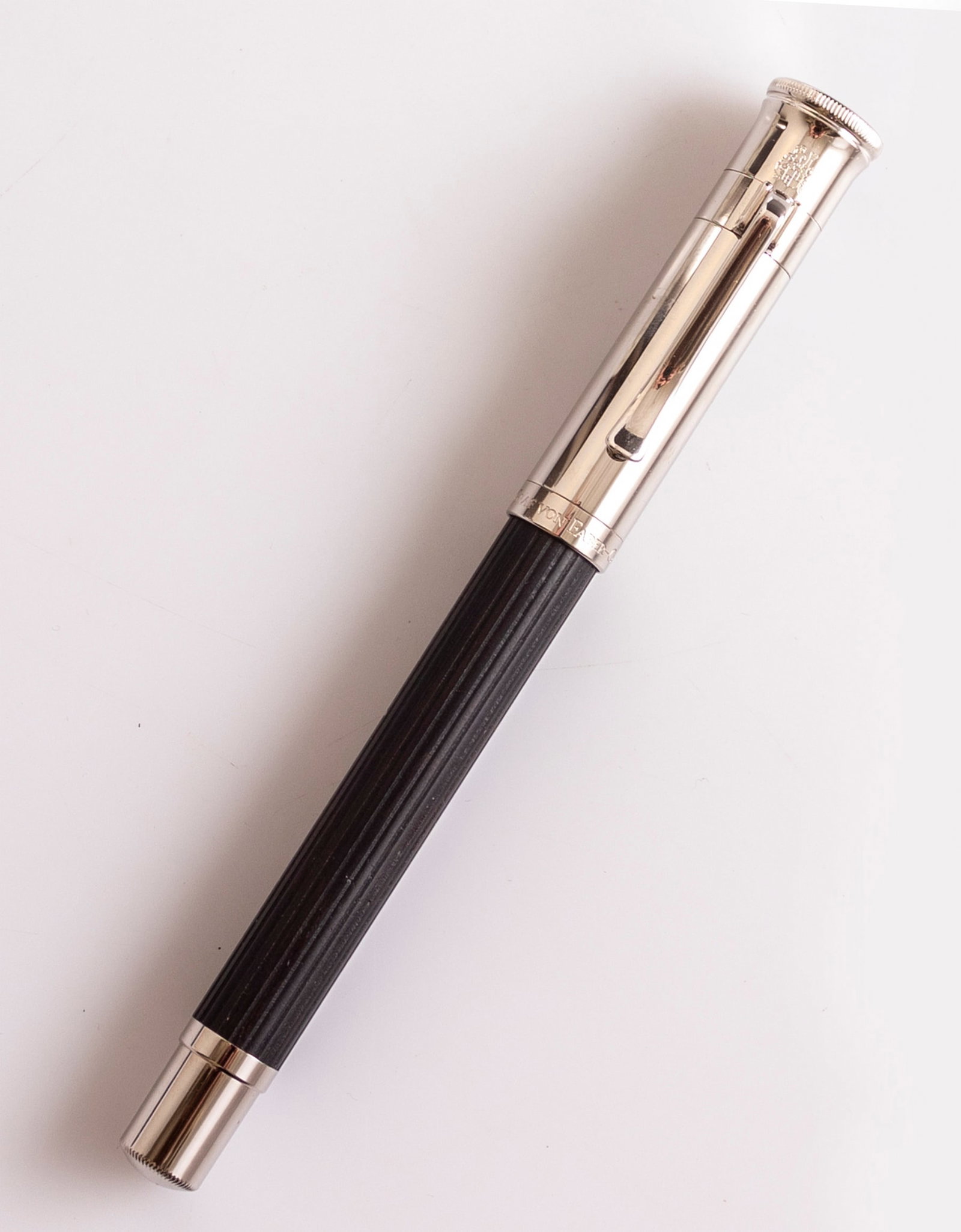 Graf von Faber-Castell Classic Fountain Pen: Graf von Faber-Castell Classic fountain pen, Ebony wood barrel and metal. Size: 5.4" (13.7 cm). 2 toned 18K gold nib, M. Excellent condition.