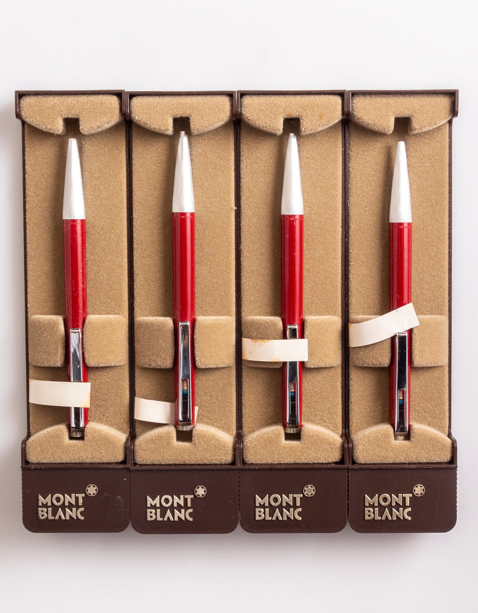 Montblanc 780 Ballpoint Pens: Lot of 4 Montblanc 780 ballpoint pens, Lever on clip, Red & steel. Size: 5" (12.7 cm). Mint, NOS, in original case, refill might be dry.